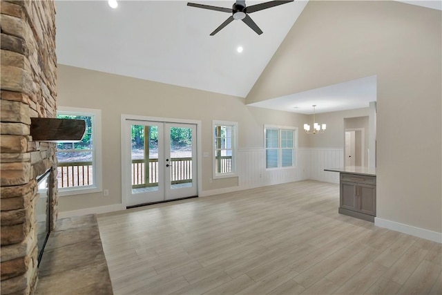 32 Pine Garden Way Dr, Salem, SC 29676 - unfurnished living room with a chandelier, ceiling fan, wainscoting, high vaulted ceiling, and light wood-type flooring