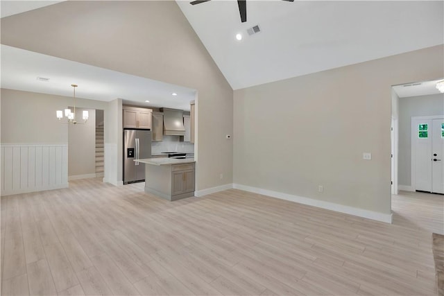 32 Pine Garden Way Dr, Salem, SC 29676 - unfurnished living room featuring a ceiling fan, a chandelier, light wood-type flooring, baseboards, and stairs