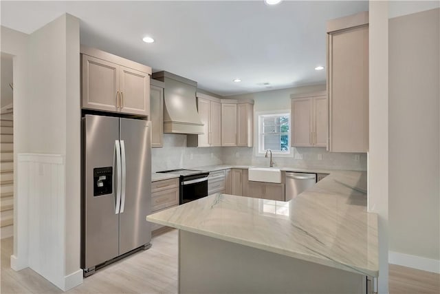 32 Pine Garden Way Dr, Salem, SC 29676 - kitchen featuring appliances with stainless steel finishes, wall chimney exhaust hood, a sink, a peninsula, and light stone countertops