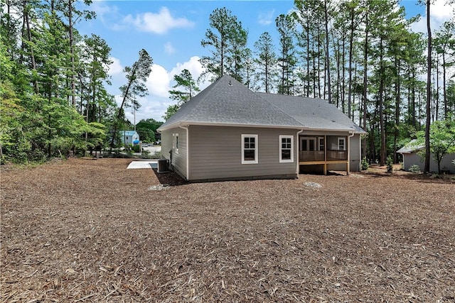 32 Pine Garden Way Dr, Salem, SC 29676 - rear view of property featuring central AC unit, roof with shingles, view of wooded area, and a wooden deck