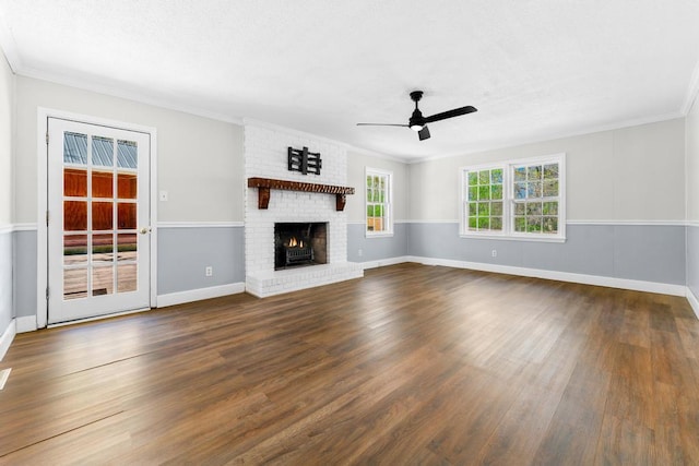 113 Woodhurst Dr, Hartwell, GA 30643 - unfurnished living room featuring a ceiling fan, dark wood-style flooring, ornamental molding, a fireplace, and baseboards