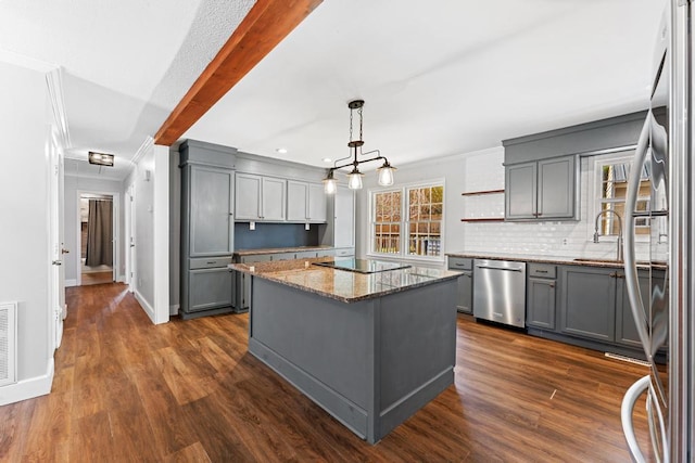 113 Woodhurst Dr, Hartwell, GA 30643 - kitchen with gray cabinetry, stainless steel appliances, stone countertops, ornamental molding, and a kitchen island