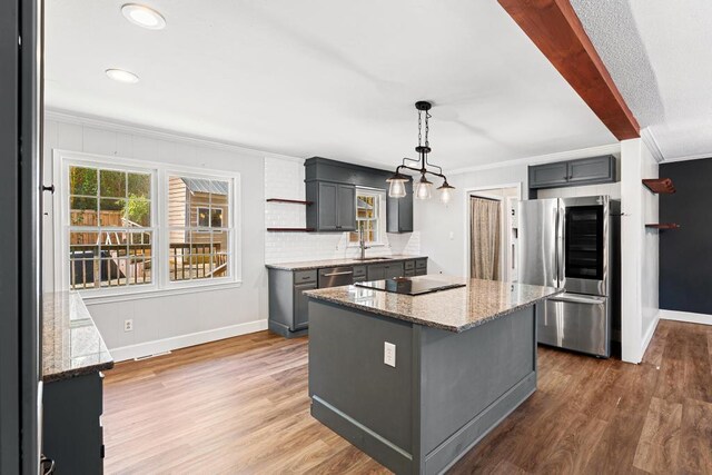 113 Woodhurst Dr, Hartwell, GA 30643 - kitchen with appliances with stainless steel finishes, gray cabinetry, a center island, baseboards, and crown molding