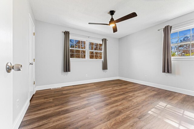 113 Woodhurst Dr, Hartwell, GA 30643 - empty room featuring wood finished floors, a ceiling fan, baseboards, and a textured ceiling