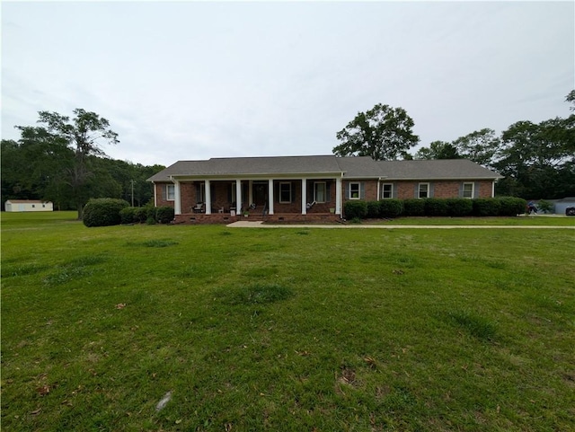 106 Emma Dr, Honea Path, SC 29654 - view of front of property featuring a porch, a front yard, and brick siding