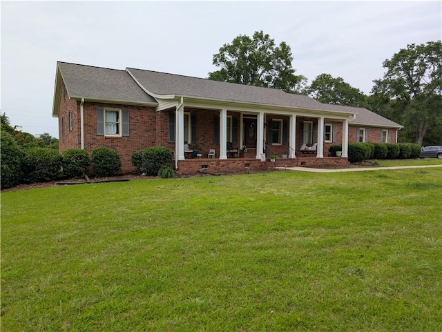 106 Emma Dr, Honea Path, SC 29654 - view of front facade featuring a porch, a front yard, brick siding, and a shingled roof