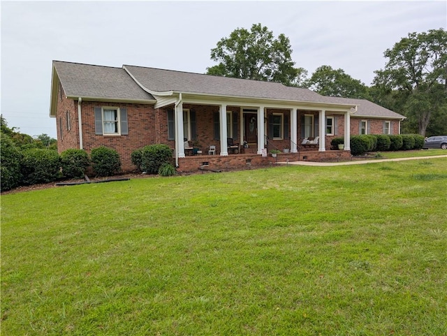 106 Emma Dr, Honea Path, SC 29654 - view of front of home featuring covered porch, a front lawn, brick siding, and a shingled roof