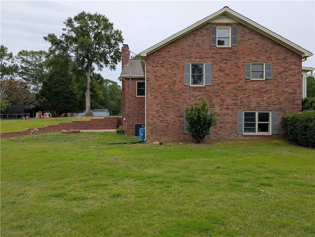 106 Emma Dr, Honea Path, SC 29654 - view of side of home with a chimney, brick siding, and a yard