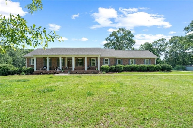 106 Emma Dr, Honea Path, SC 29654 - ranch-style home featuring a porch, a front yard, and brick siding