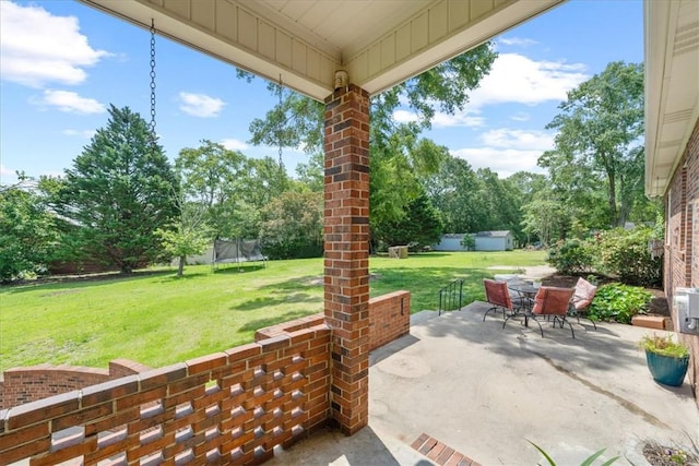 106 Emma Dr, Honea Path, SC 29654 - view of patio / terrace with a trampoline, outdoor dining area, and view of wooded area