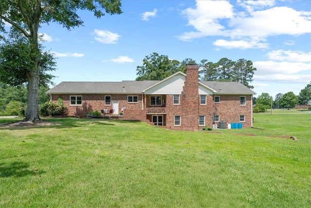 106 Emma Dr, Honea Path, SC 29654 - rear view of property featuring a lawn, brick siding, and a chimney