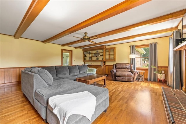 106 Emma Dr, Honea Path, SC 29654 - living room with light wood-style floors, beamed ceiling, a wainscoted wall, wood walls, and a ceiling fan