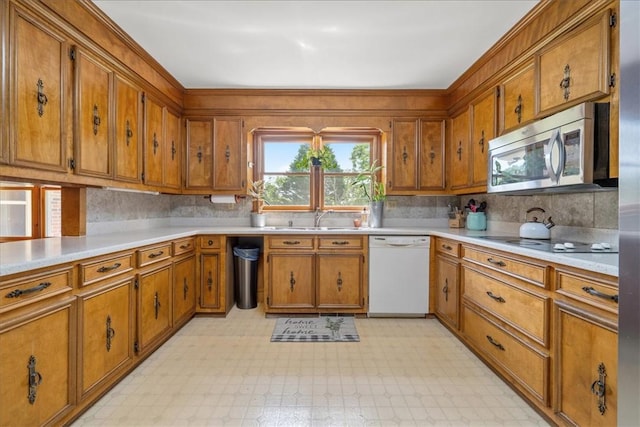 106 Emma Dr, Honea Path, SC 29654 - kitchen featuring white dishwasher, stainless steel microwave, and brown cabinetry