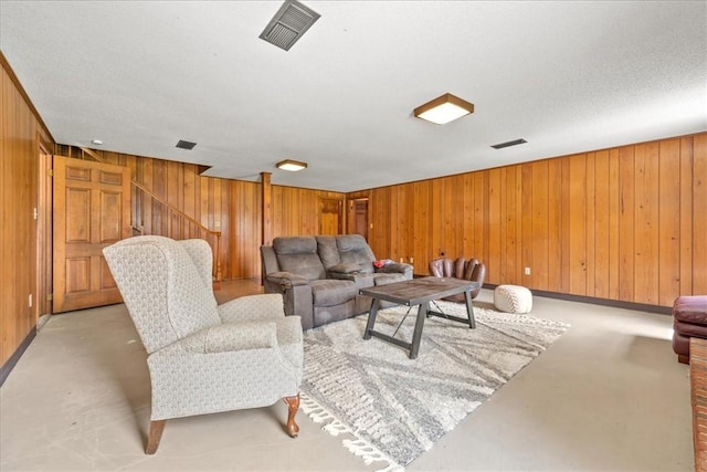 106 Emma Dr, Honea Path, SC 29654 - living room with concrete floors and wooden walls