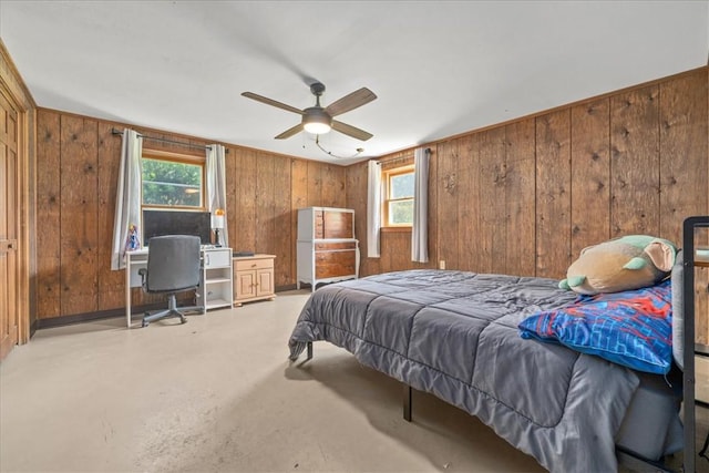 106 Emma Dr, Honea Path, SC 29654 - bedroom with multiple windows, wooden walls, concrete flooring, an office area, and a ceiling fan