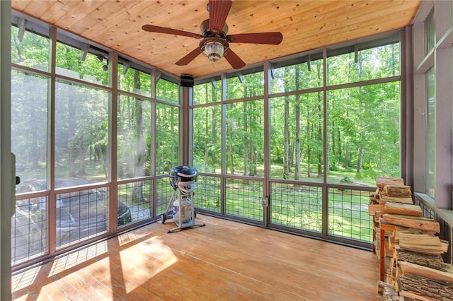 1457 Cheohee Valley Rd, Tamassee, SC 29686 - unfurnished sunroom featuring a ceiling fan and a wooded view