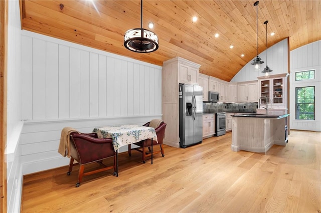 1457 Cheohee Valley Rd, Tamassee, SC 29686 - kitchen with stainless steel appliances, wood ceiling, lofted ceiling, dark countertops, and light wood-style floors