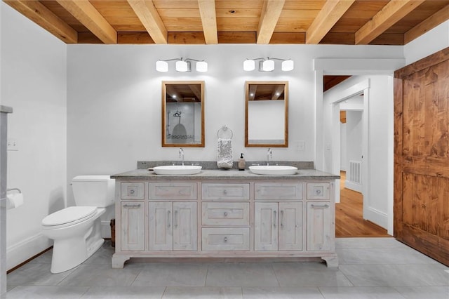 1457 Cheohee Valley Rd, Tamassee, SC 29686 - full bath with double vanity, wooden ceiling with exposed beams, tile patterned flooring, baseboards, and toilet