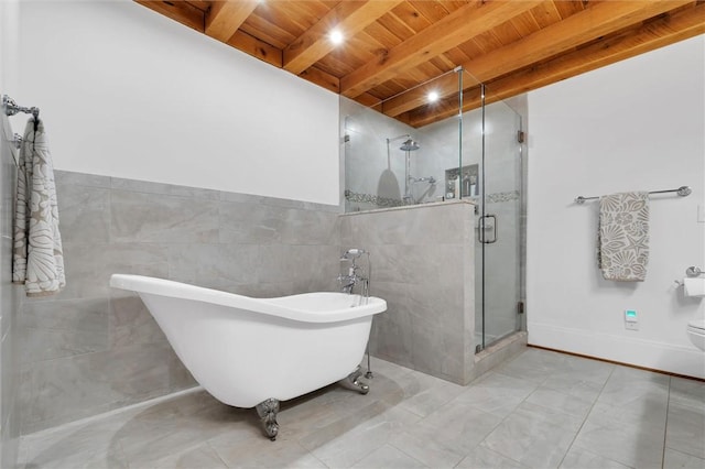 1457 Cheohee Valley Rd, Tamassee, SC 29686 - bathroom featuring wood ceiling with exposed beams, a soaking tub, marble finish flooring, a shower stall, and tile walls