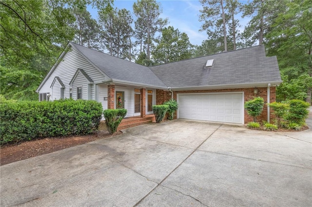 1029 Cross Creek Dr, Seneca, SC 29678 - view of front of property featuring concrete driveway, a garage, brick siding, and a shingled roof
