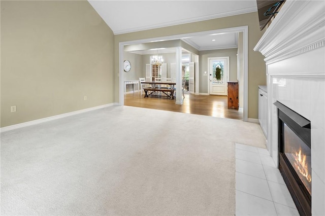 1029 Cross Creek Dr, Seneca, SC 29678 - living room featuring light carpet, a tile fireplace, ornamental molding, baseboards, and a chandelier