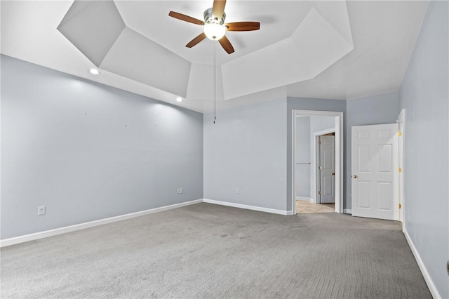 1029 Cross Creek Dr, Seneca, SC 29678 - spare room featuring carpet, a raised ceiling, a ceiling fan, baseboards, and recessed lighting