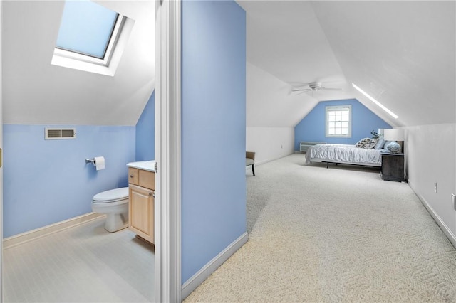 1029 Cross Creek Dr, Seneca, SC 29678 - carpeted bedroom featuring lofted ceiling, a skylight, baseboards, and ceiling fan