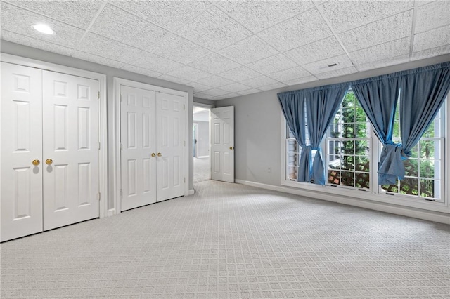 1029 Cross Creek Dr, Seneca, SC 29678 - unfurnished bedroom featuring multiple closets, baseboards, carpet floors, a drop ceiling, and recessed lighting