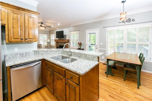 205 Shadow Oaks Dr, Easley, SC 29642 - kitchen featuring dishwasher, a peninsula, a sink, crown molding, and brown cabinets
