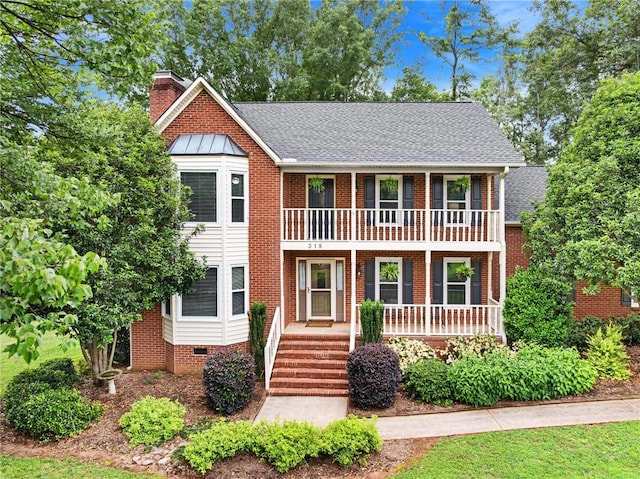 318 Chenoweth Dr, Simpsonville, SC 29681 - view of front of property with a balcony, a porch, a chimney, and roof with shingles