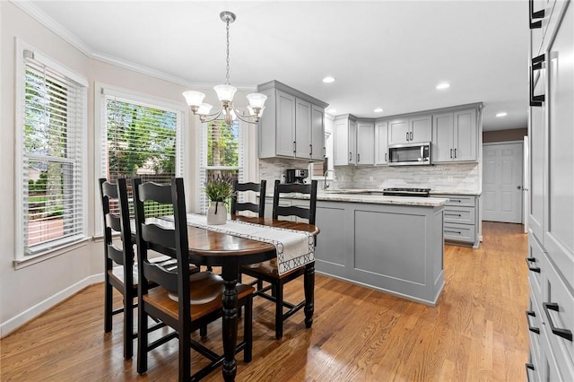 318 Chenoweth Dr, Simpsonville, SC 29681 - dining room with a chandelier, light wood finished floors, crown molding, baseboards, and recessed lighting