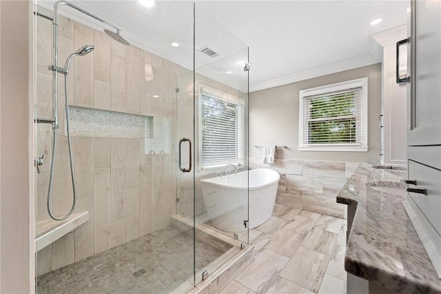 318 Chenoweth Dr, Simpsonville, SC 29681 - full bathroom featuring a soaking tub, a shower stall, crown molding, double vanity, and tile walls