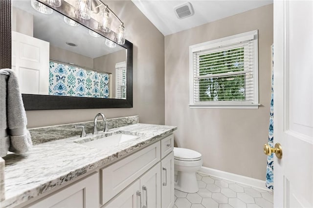 318 Chenoweth Dr, Simpsonville, SC 29681 - full bath featuring vanity, toilet, tile patterned floors, and baseboards