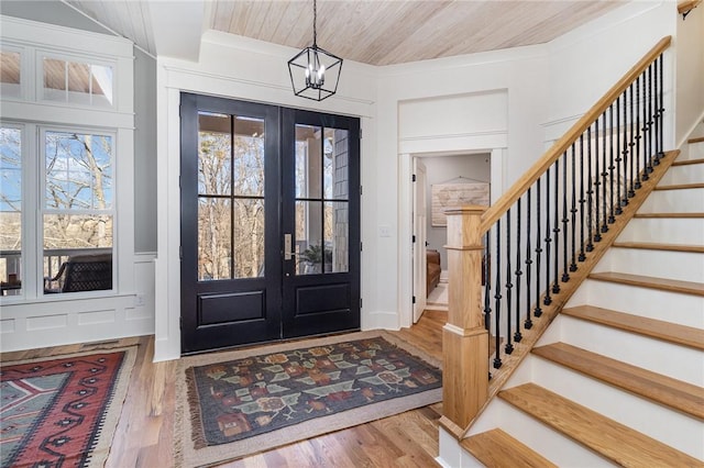 1819 Cross Creek Dr, Seneca, SC 29678 - entryway with stairs, french doors, a chandelier, wood finished floors, and a decorative wall