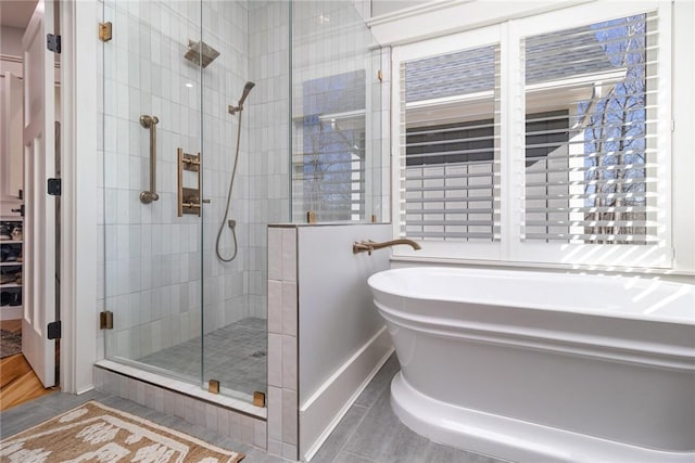 1819 Cross Creek Dr, Seneca, SC 29678 - bathroom with a stall shower, a freestanding bath, and tile patterned flooring