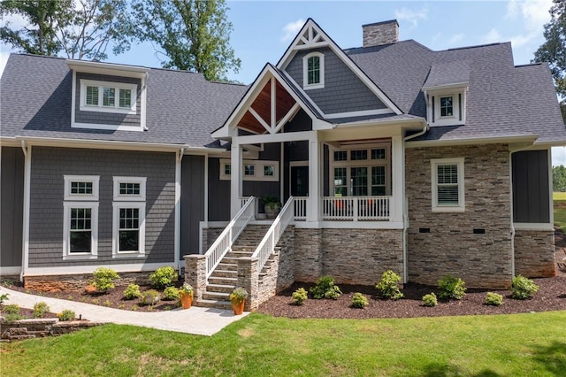 1819 Cross Creek Dr, Seneca, SC 29678 - craftsman-style home with stone siding, a porch, a chimney, and a front yard