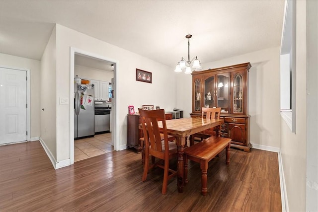 500 Concord Rd Unit A4, Anderson, SC 29621 - dining space with a chandelier, wood finished floors, and baseboards
