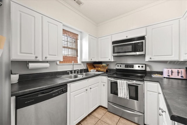 500 Concord Rd Unit A4, Anderson, SC 29621 - kitchen with appliances with stainless steel finishes, a sink, dark countertops, crown molding, and white cabinetry