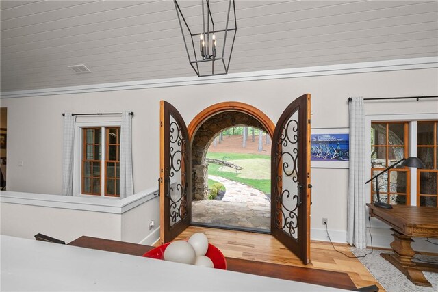 301 Augusta Way, Sunset, SC 29685 - foyer featuring wood finished floors, a chandelier, and baseboards