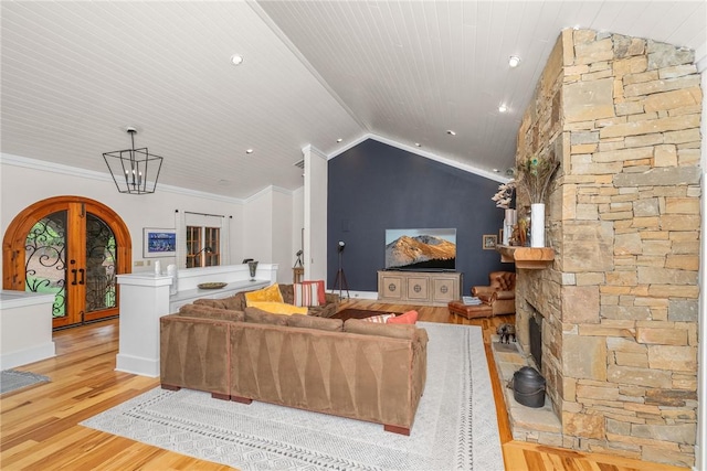 301 Augusta Way, Sunset, SC 29685 - living room featuring light wood finished floors, lofted ceiling, french doors, arched walkways, and ornamental molding