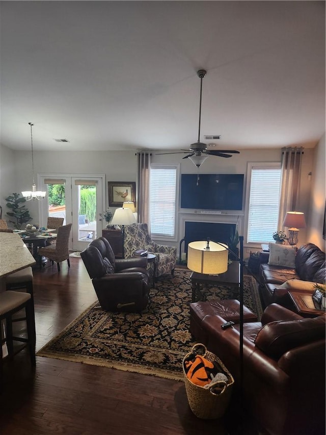 256 Chickadee Trl, Easley, SC 29642 - living area with ceiling fan, healthy amount of natural light, wood finished floors, and a chandelier