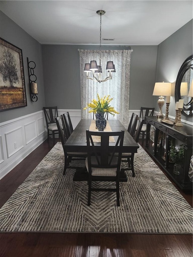 256 Chickadee Trl, Easley, SC 29642 - dining area featuring a chandelier, wainscoting, and wood finished floors