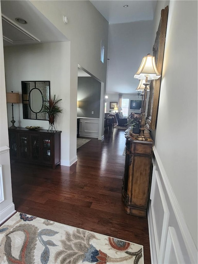 256 Chickadee Trl, Easley, SC 29642 - hall with wood finished floors, a decorative wall, and wainscoting