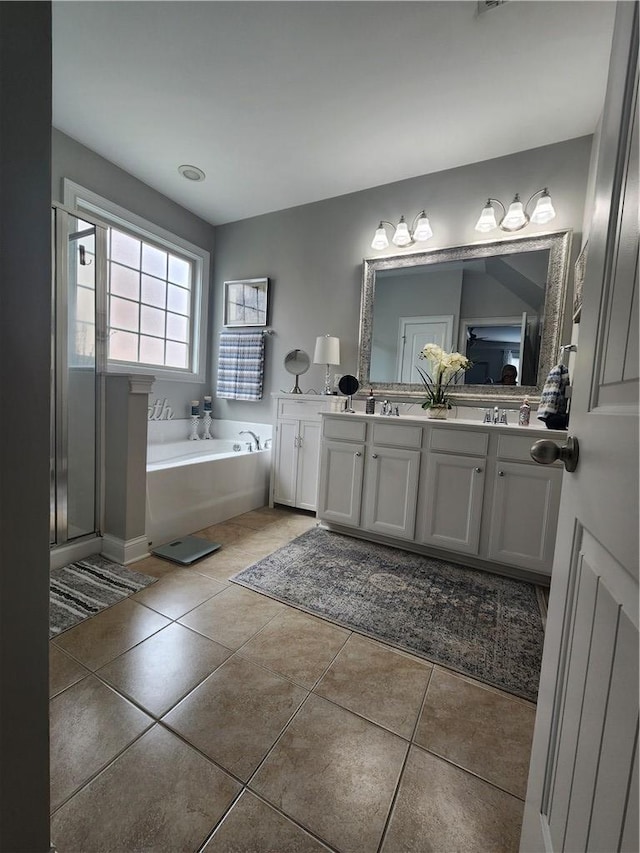 256 Chickadee Trl, Easley, SC 29642 - bathroom with double vanity, a bath, and tile patterned flooring