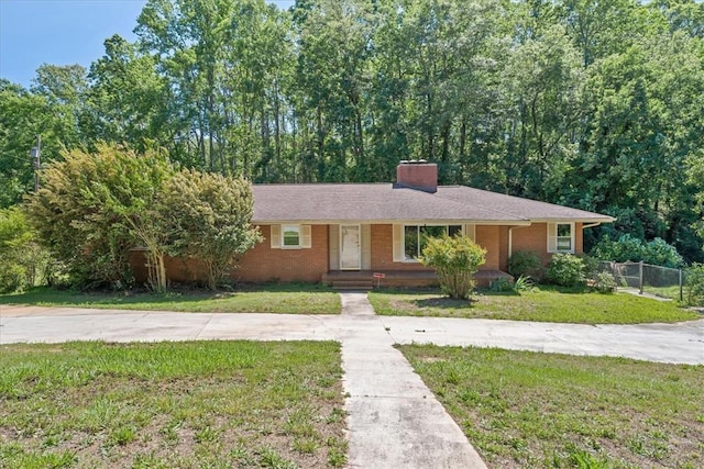 1122 Cox Rd, Anderson, SC 29621 - ranch-style house featuring a chimney, brick siding, and a porch