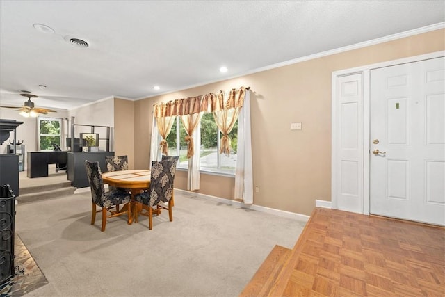 1122 Cox Rd, Anderson, SC 29621 - dining room featuring baseboards, a wood stove, ceiling fan, crown molding, and recessed lighting