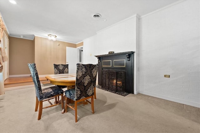 1122 Cox Rd, Anderson, SC 29621 - dining room featuring light carpet, crown molding, a fireplace with flush hearth, and baseboards