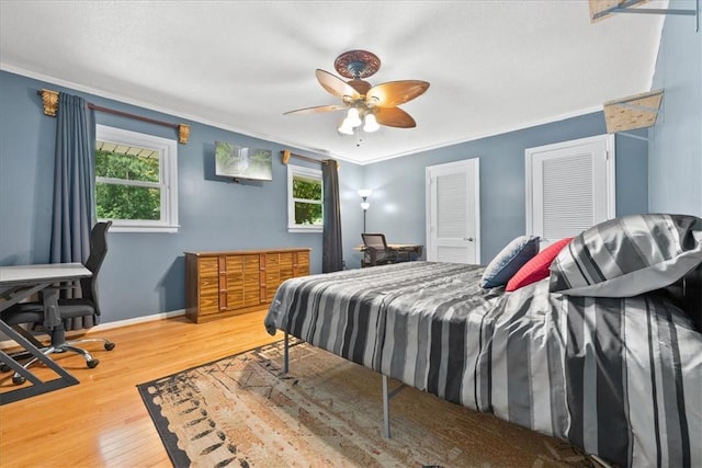 1122 Cox Rd, Anderson, SC 29621 - bedroom with wood finished floors, crown molding, baseboards, a ceiling fan, and a desk
