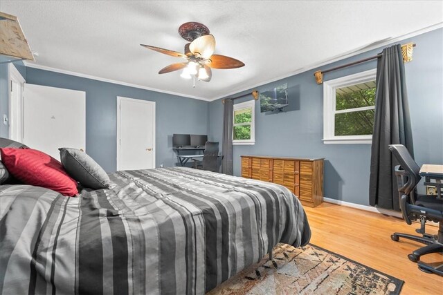 1122 Cox Rd, Anderson, SC 29621 - bedroom featuring wood finished floors, crown molding, a desk, baseboards, and a ceiling fan