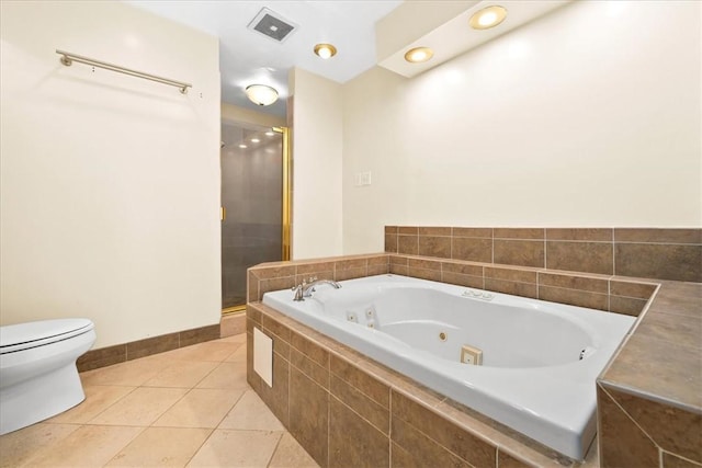 1122 Cox Rd, Anderson, SC 29621 - bathroom with a tub with jets, toilet, a stall shower, tile patterned flooring, and baseboards